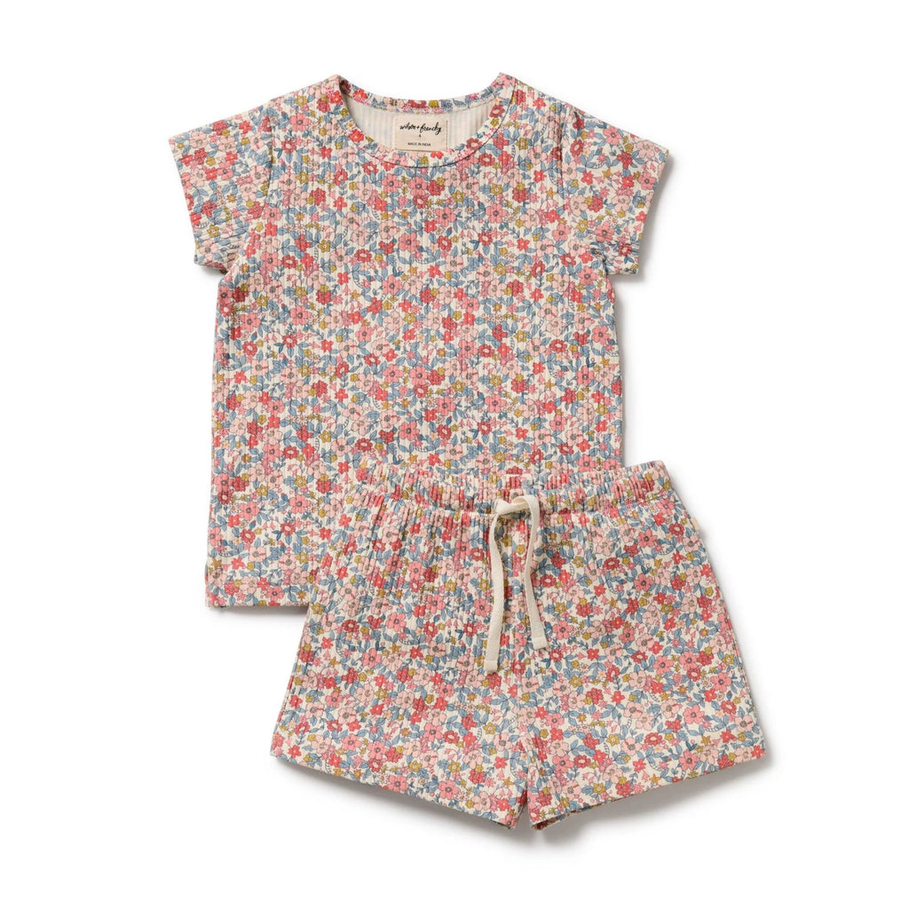 Floral-patterned romper set on a white background