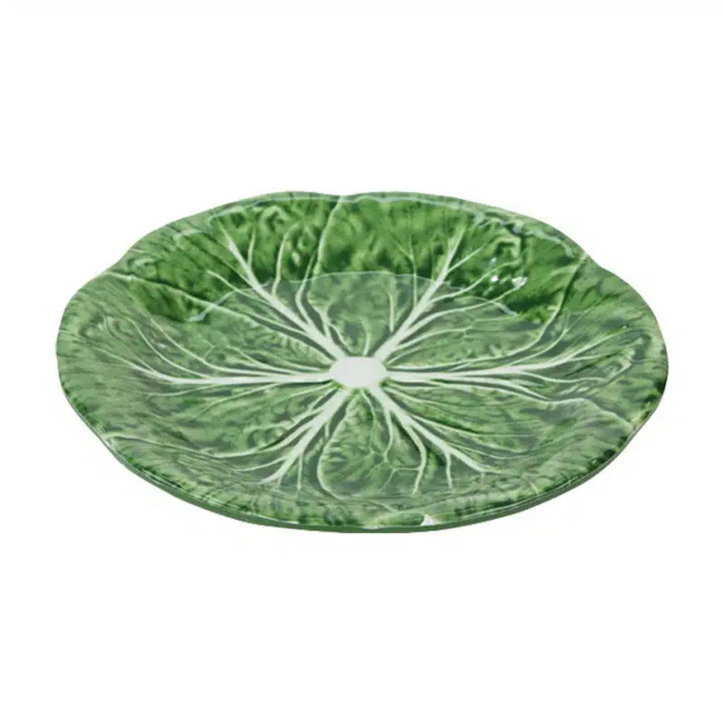 Cabbage leaf-shaped plate on a white background
