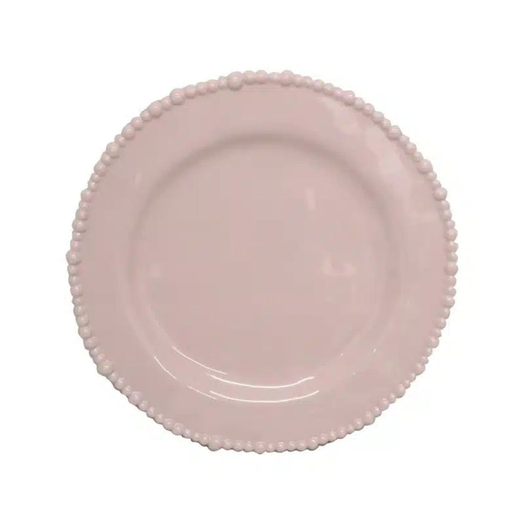 Pink melamine plate with textured rim on a white background