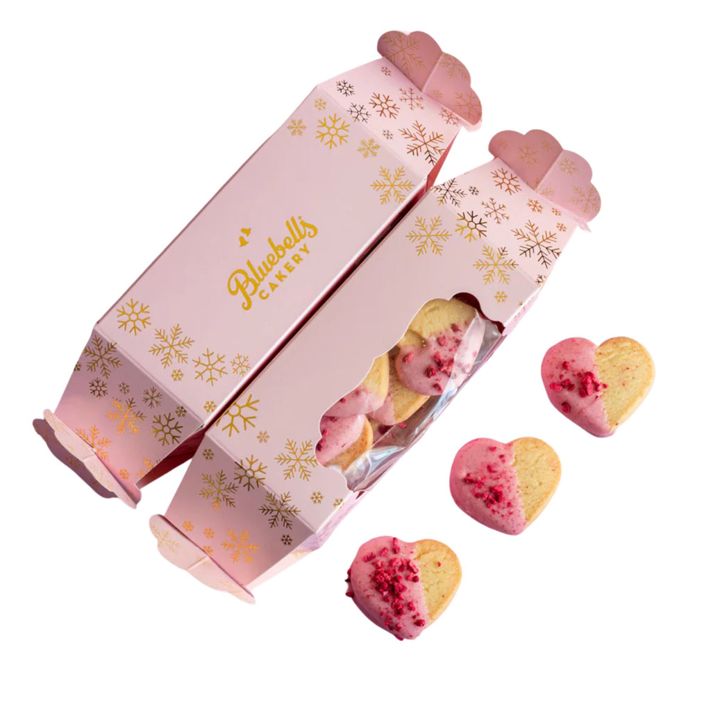 Pink packaging with heart-shaped cookies featuring Bluebells Dairy branding on a white background