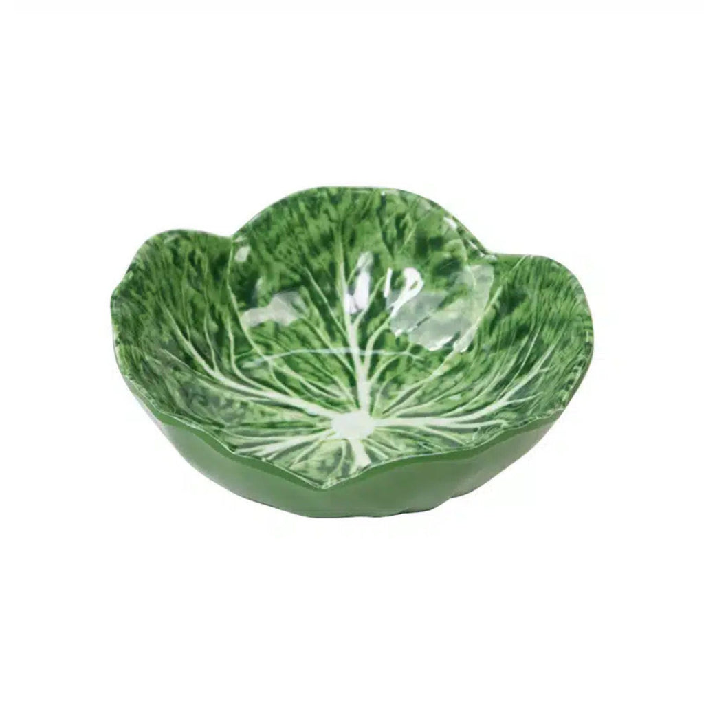 Green ceramic bowl with leaf pattern on a white background