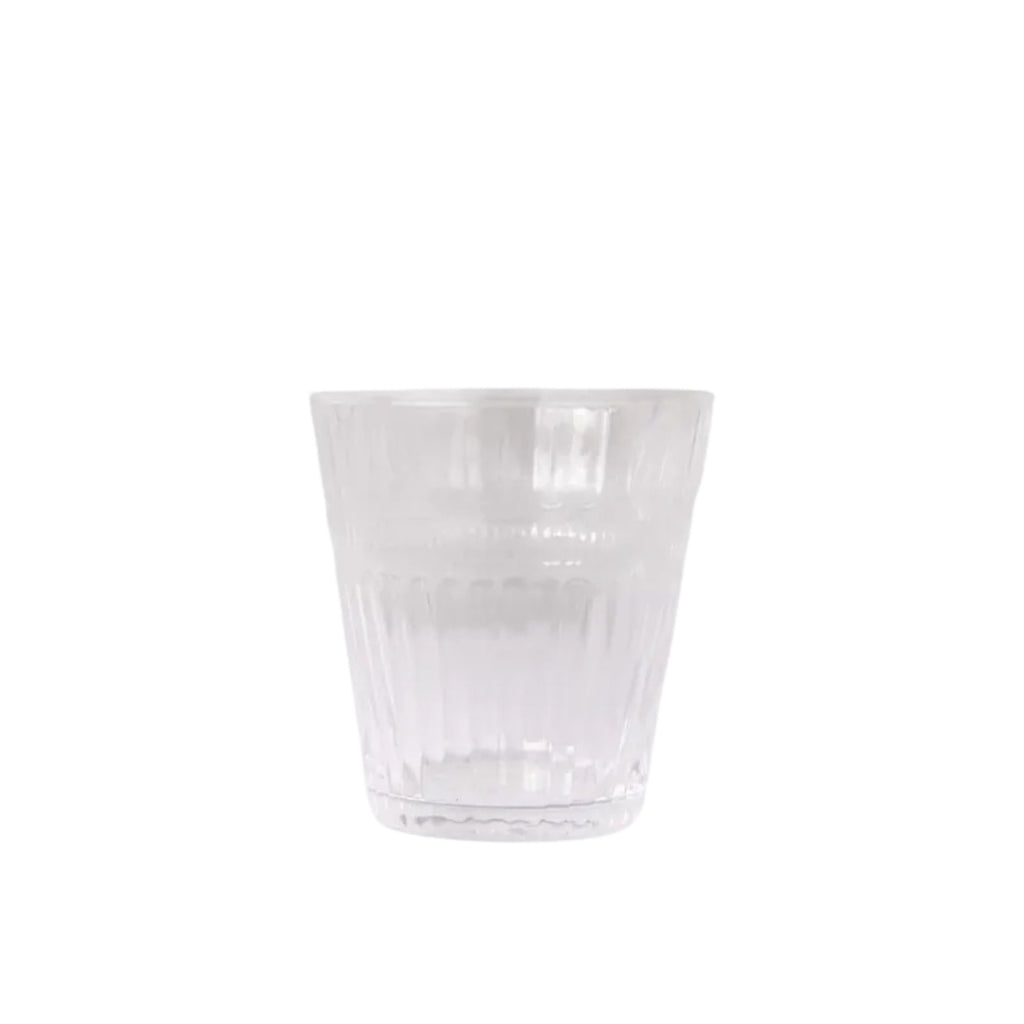 Clear glass tumbler on a white background