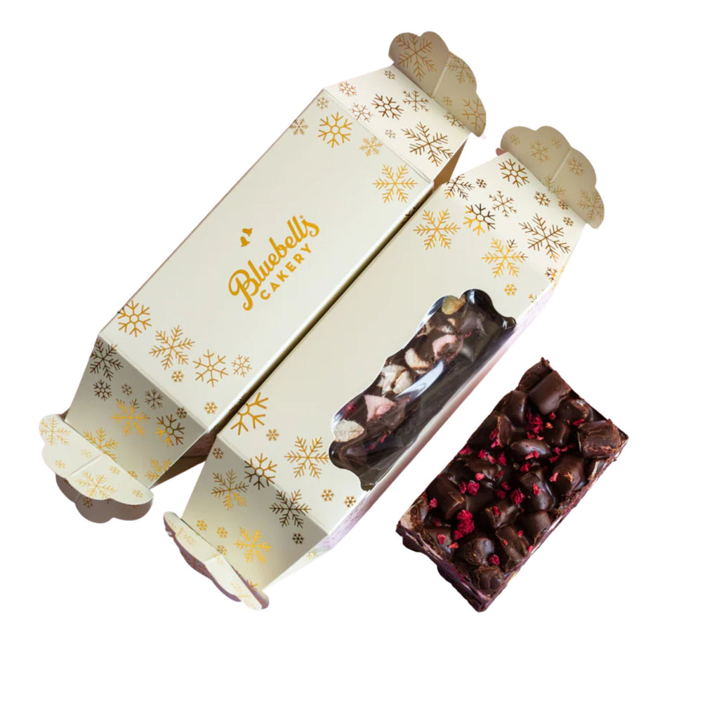 Chocolate bars in a decorative box with 'Bluebells Candy' branding on a white background