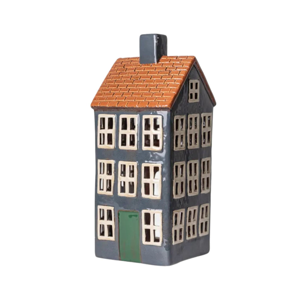 Model of a house with a red roof on a white background