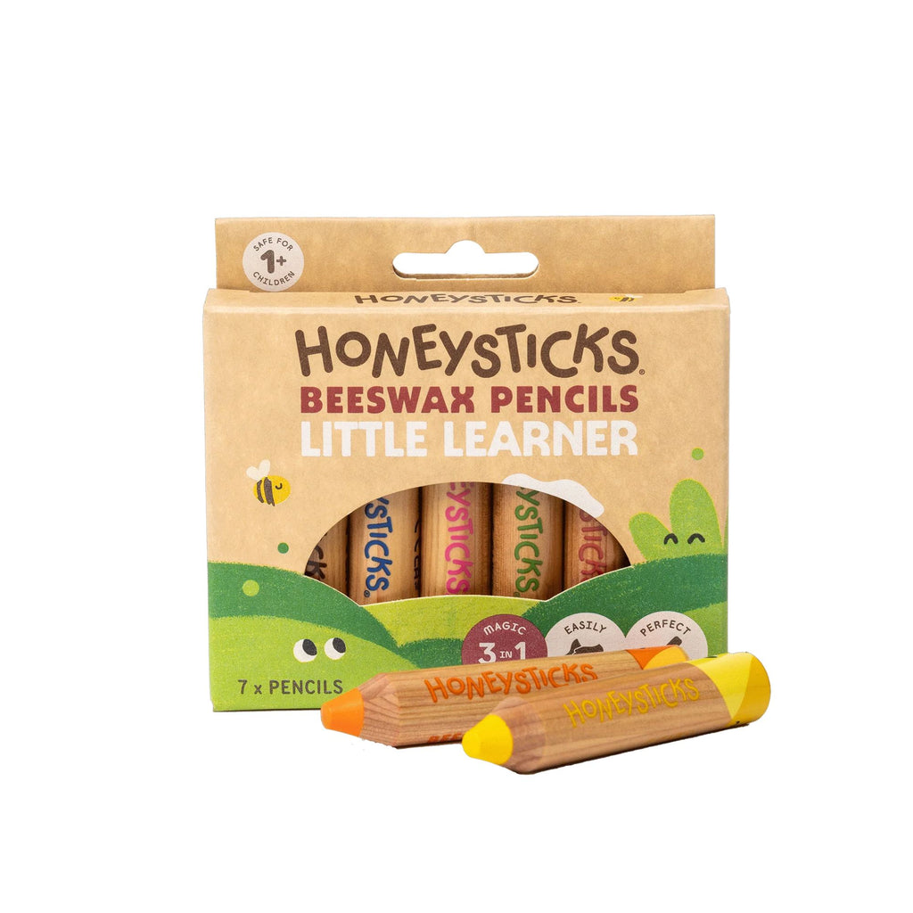 Packaging of Honeysticks Beeswax Pencils with two pencils displayed in front on a white background.
