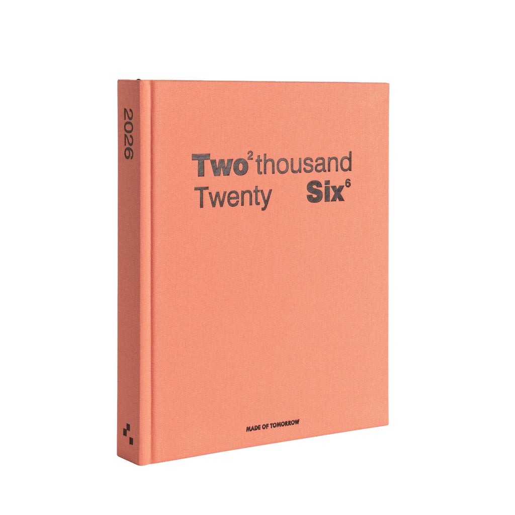 Peach-colored book with 'Two thousand Twenty Six' text on a white background