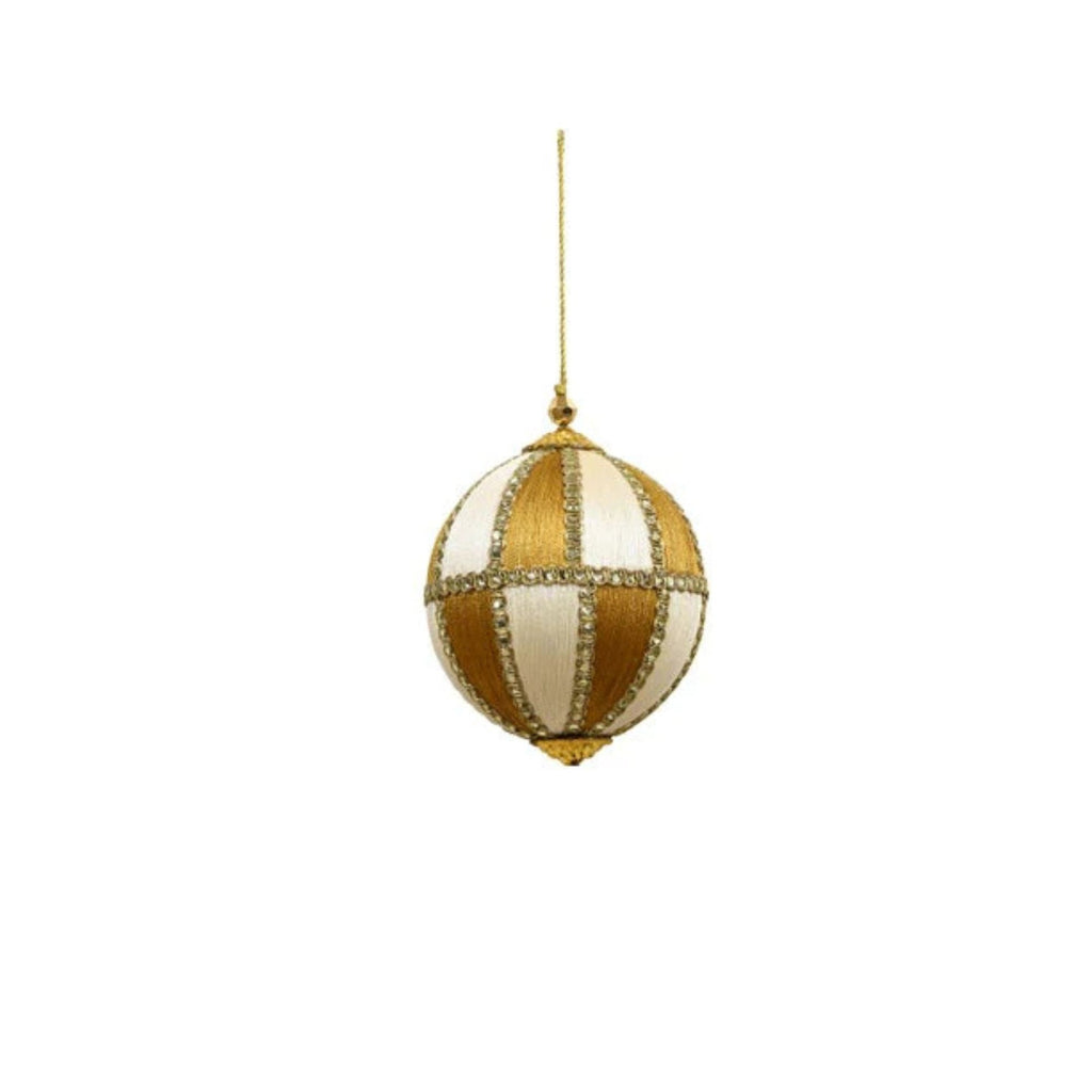Decorative gold and white striped ball ornament on a white background