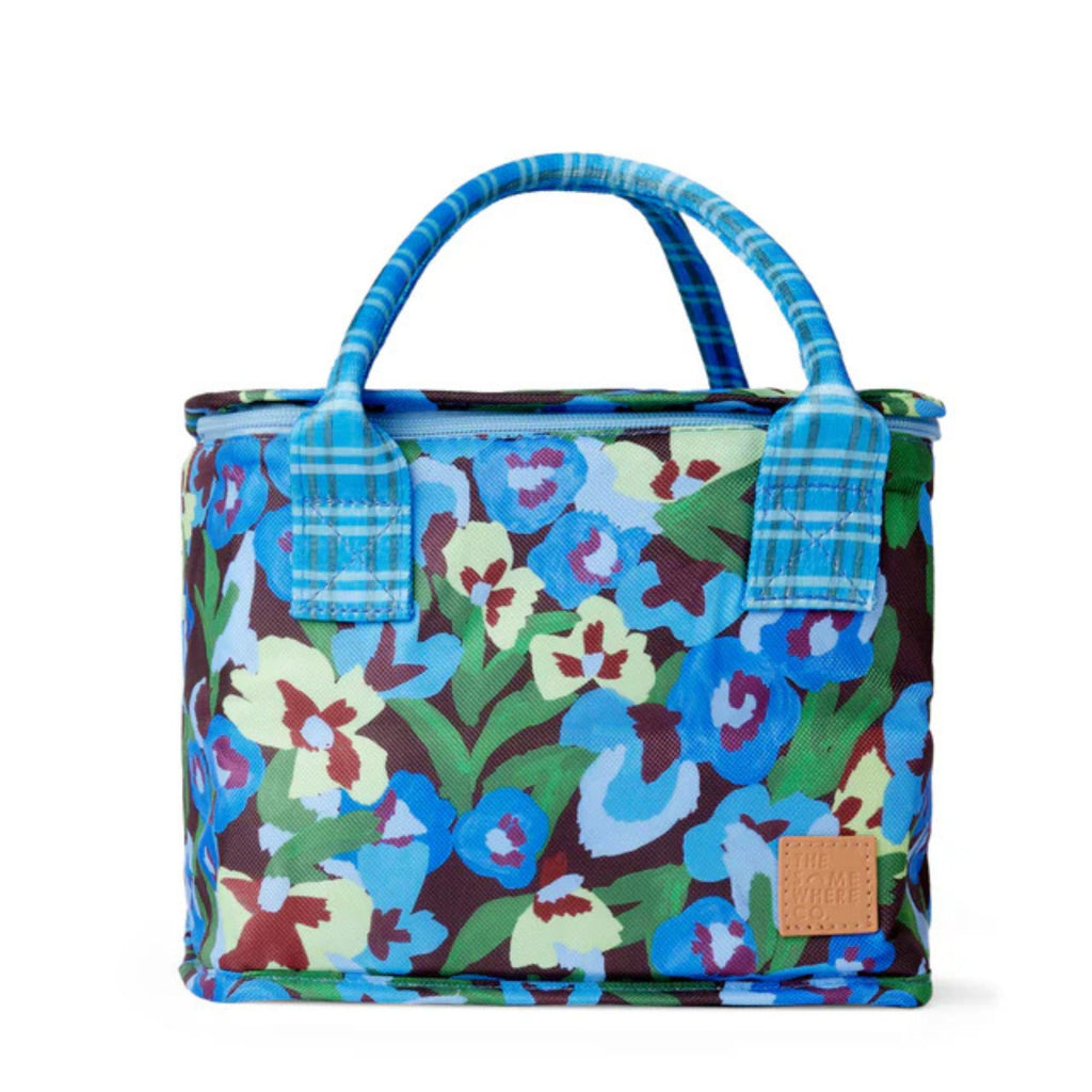 Floral-patterned lunch bag with blue handles on a white background