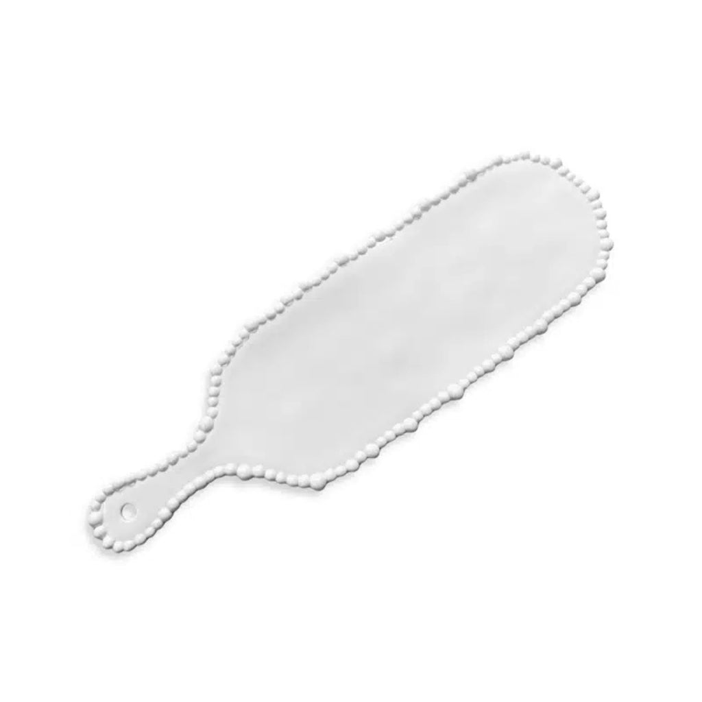 White paddle with scalloped edge on a white background