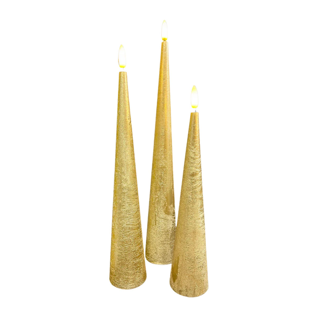 Three gold cone-shaped candles on a white background