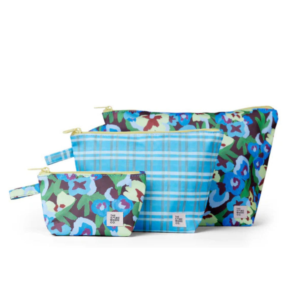 Set of three floral-patterned pouches on a white background