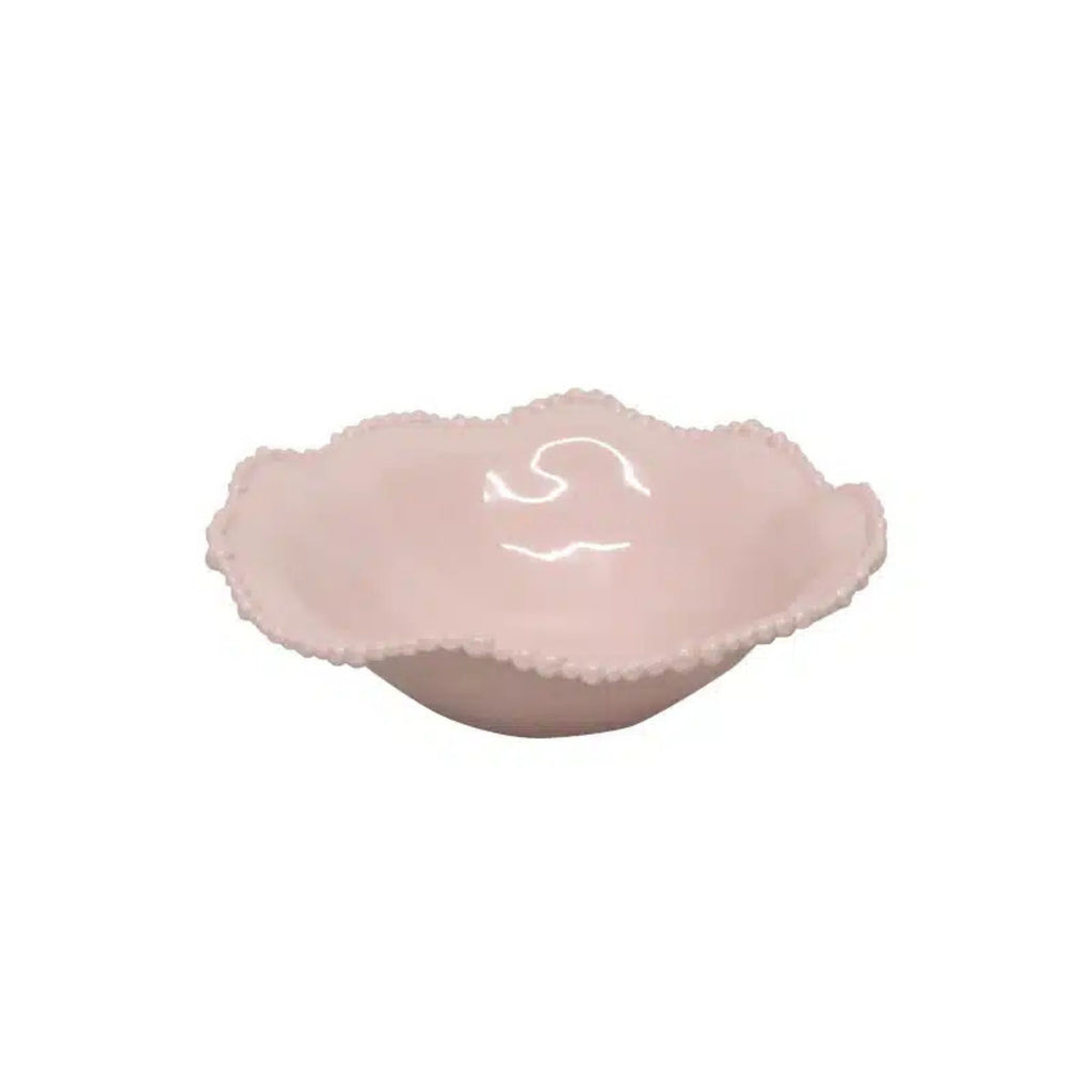 Pink melamine bowl with scalloped edge on a white background