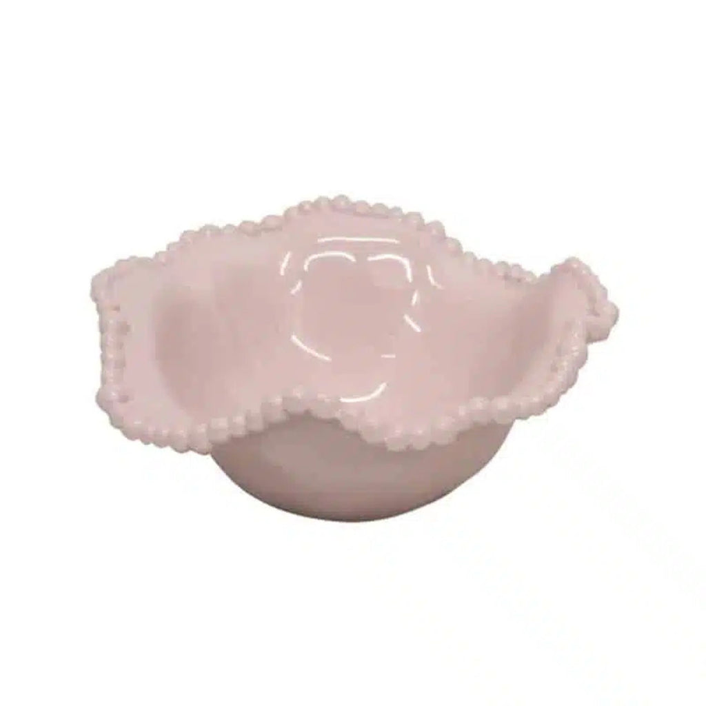 Pink melamine bowl with textured surface on a white background