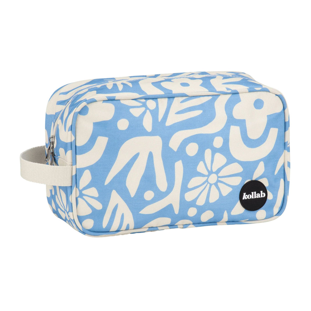 Blue toiletry bag with white floral pattern on a white background