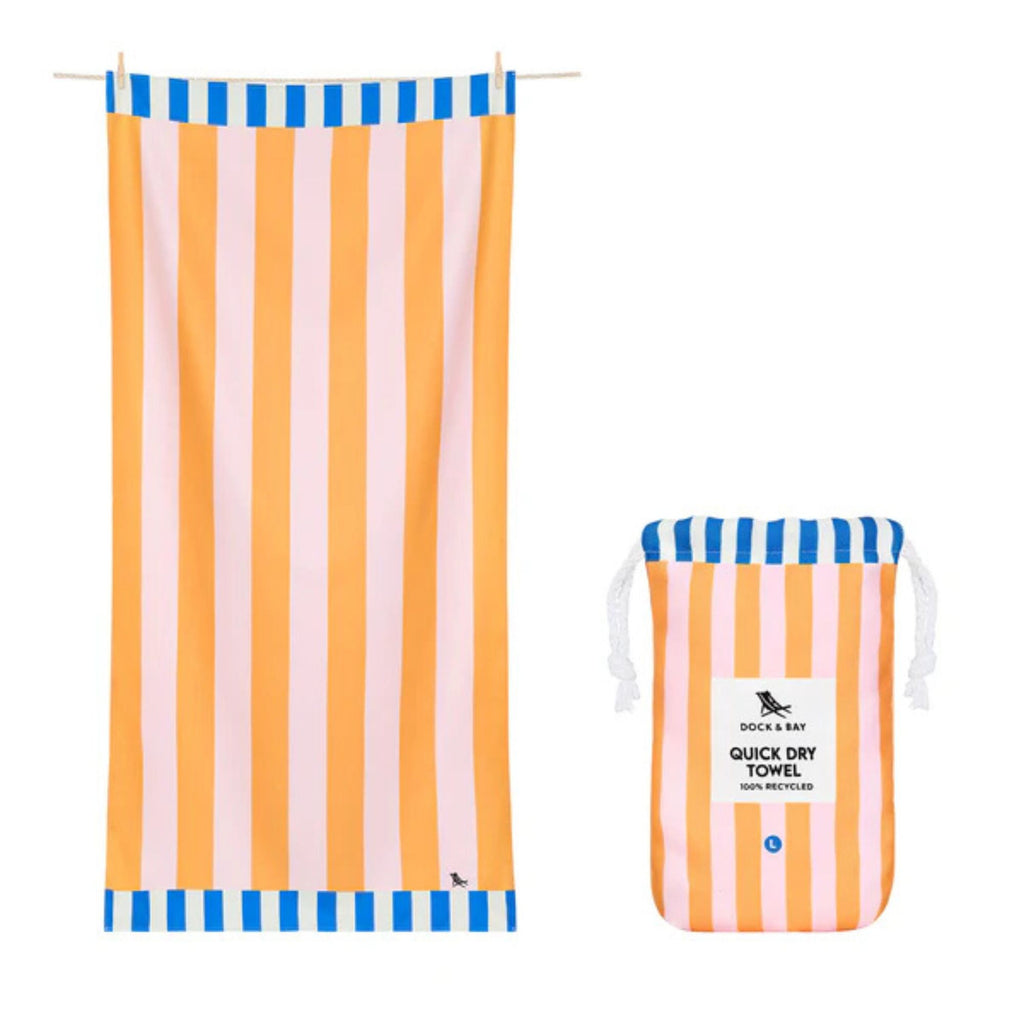 Striped beach towel with matching pouch on a white background