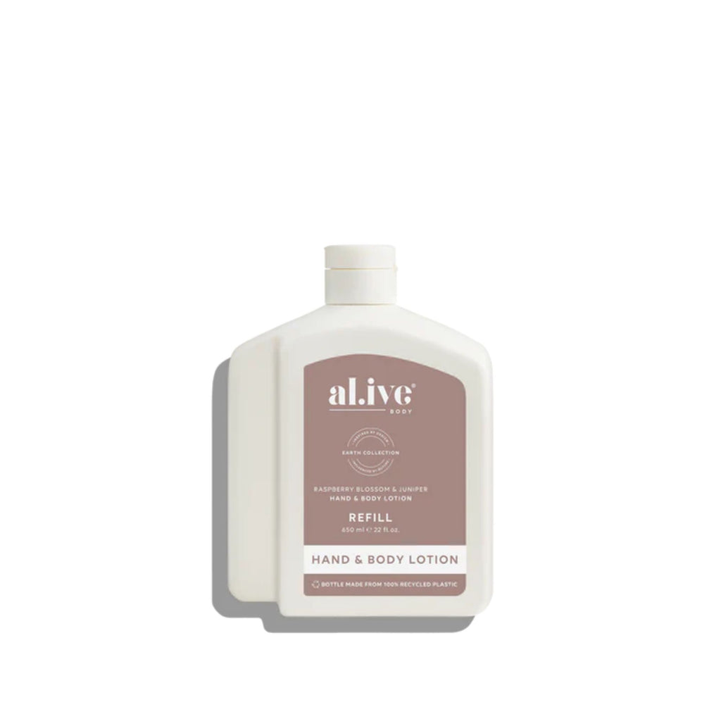 White bottle of al.ive hand and body lotion refill on a white background