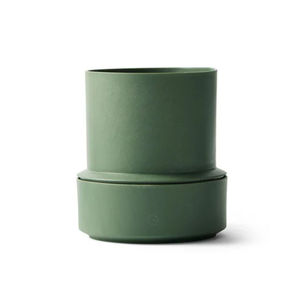 Green cylindrical container on a white background
