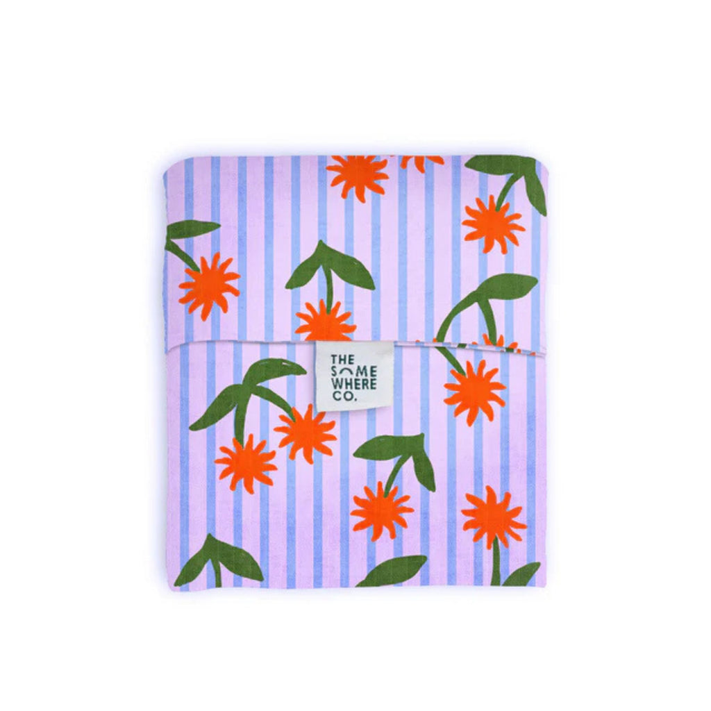 Notebook with floral design and striped pattern on a white background