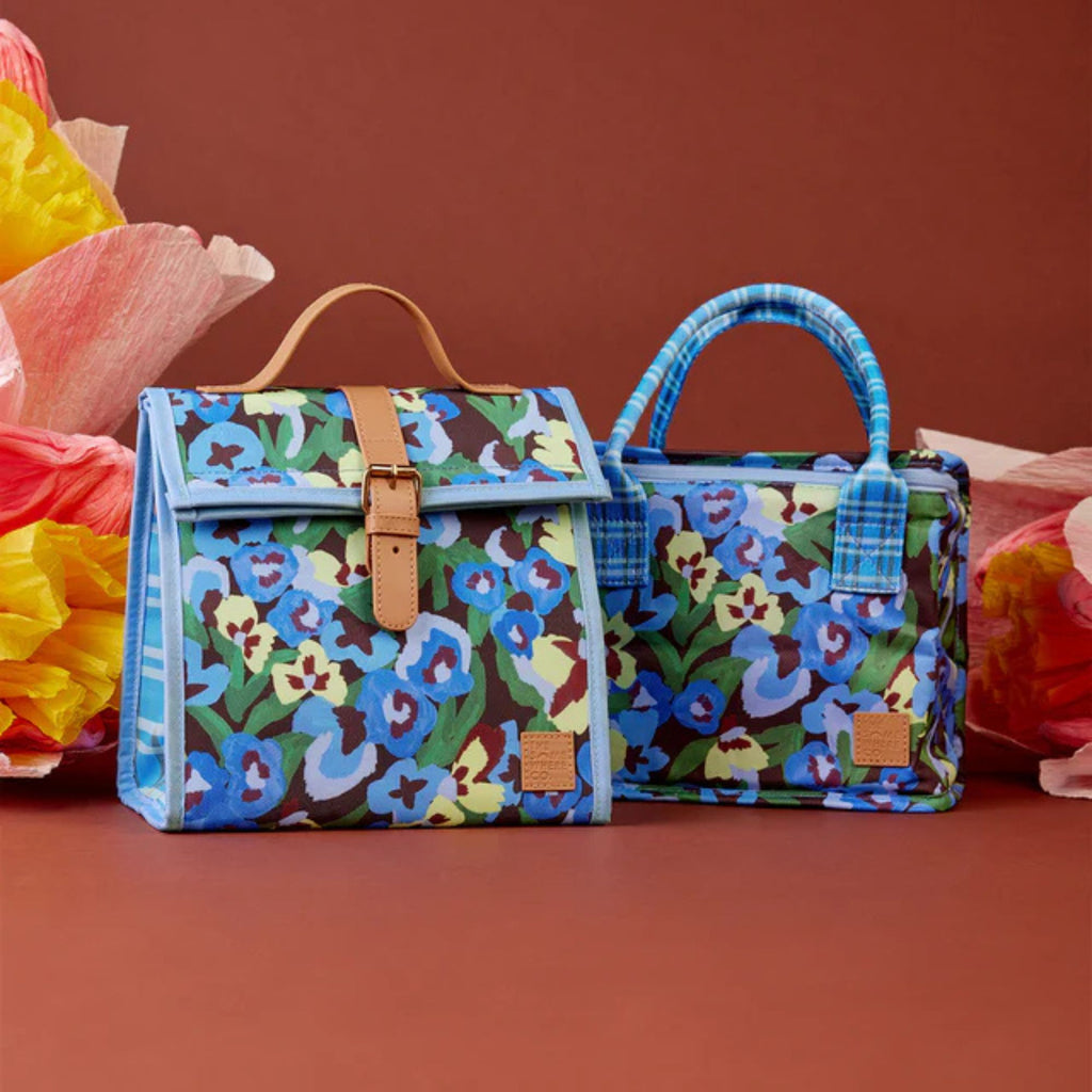 Two floral-patterned bags on a brown background with colorful flowers.