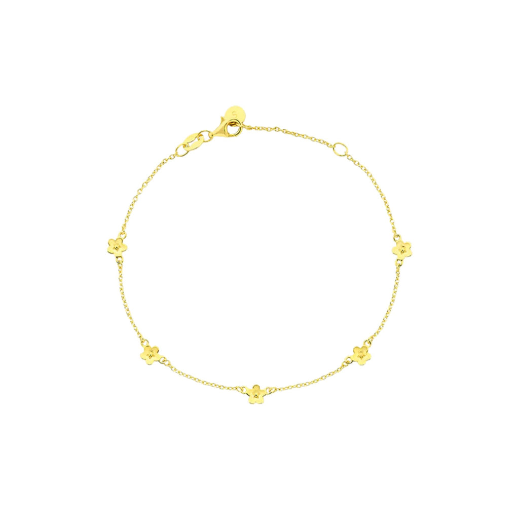 Gold bracelet with small daisies on a white background