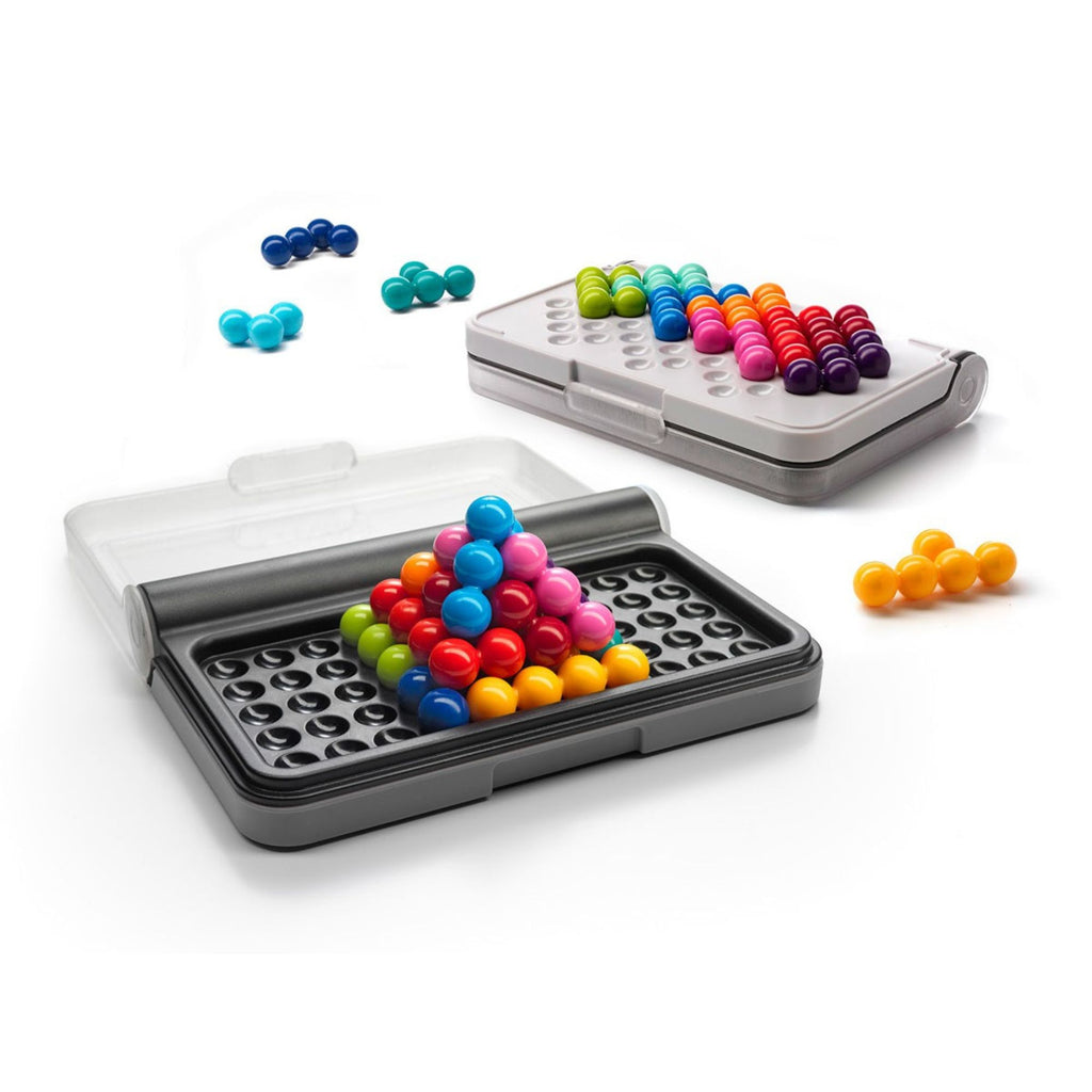 Colorful magnetic building set with storage case on a white background