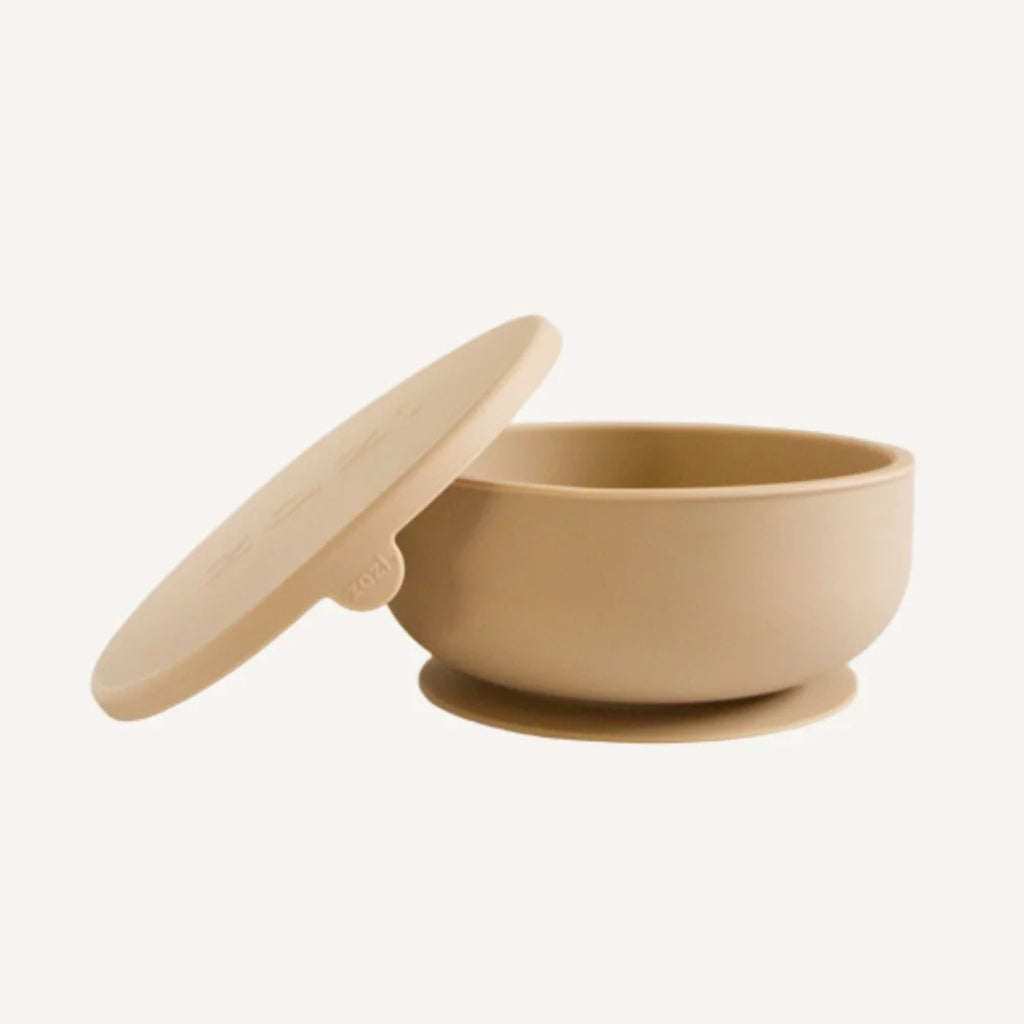Beige bowl with a lid on a white background