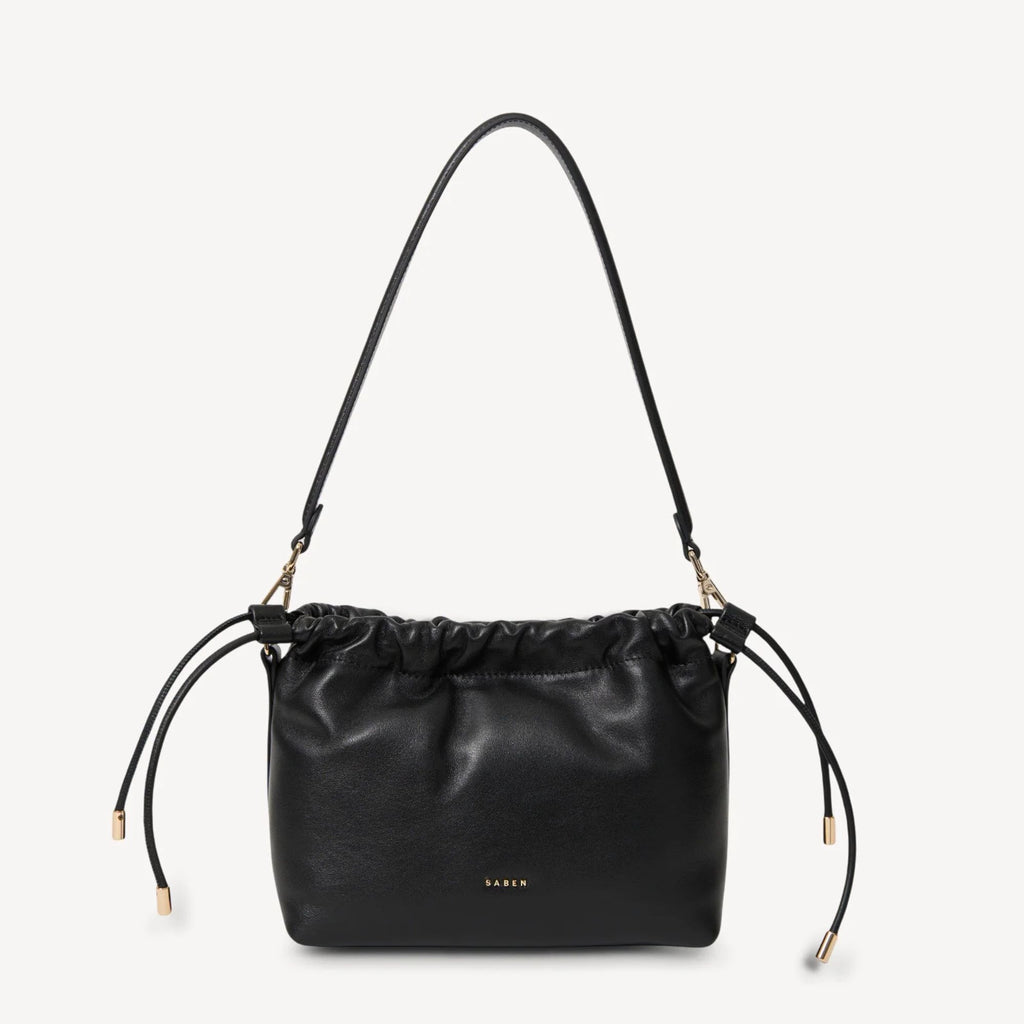 Black leather handbag with drawstring on a light gray background