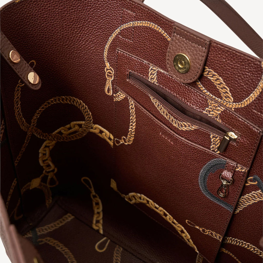 Brown leather handbag with gold chain details on a white background