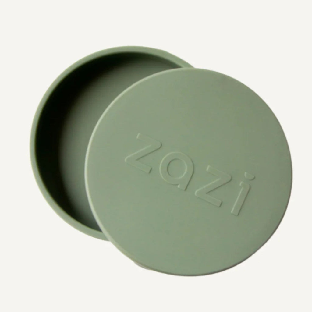Green container with lid on a white background