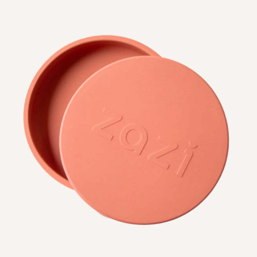 Coral-colored lid with 'Zozi' branding on a white background