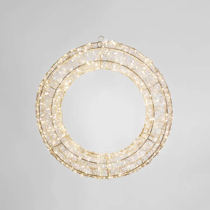 Decorative wreath with lights on a gray background