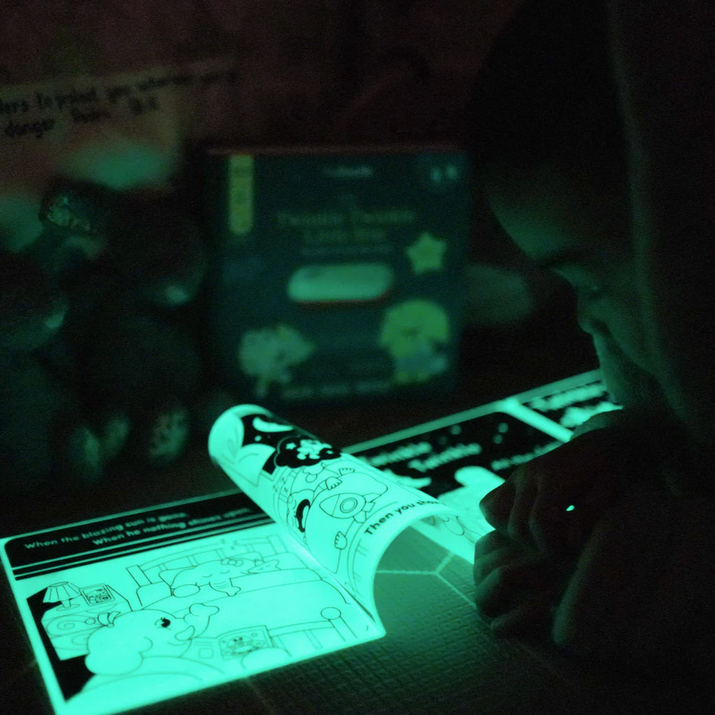 Glowing worksheet with a pen in a dark setting