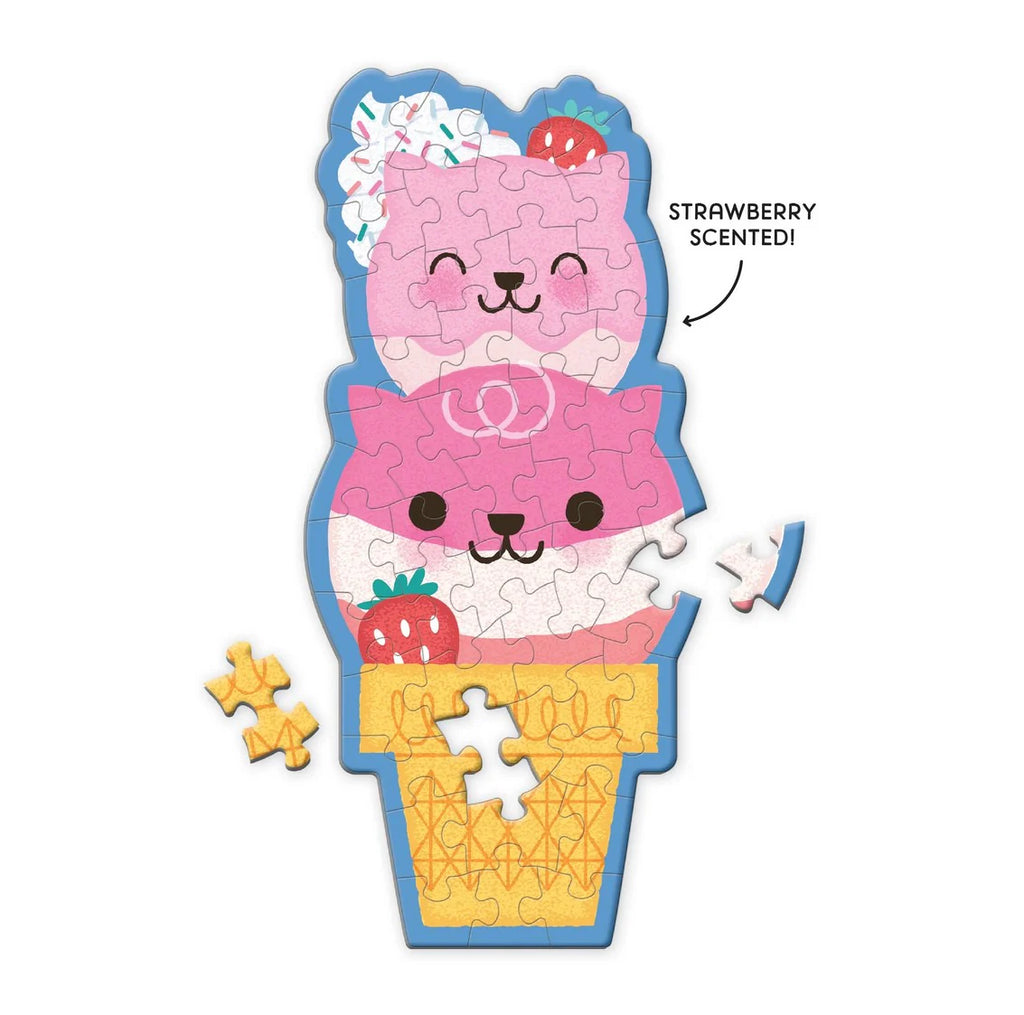 Scented puzzle shaped like a strawberry ice cream cone with a pink cat design on a white background.