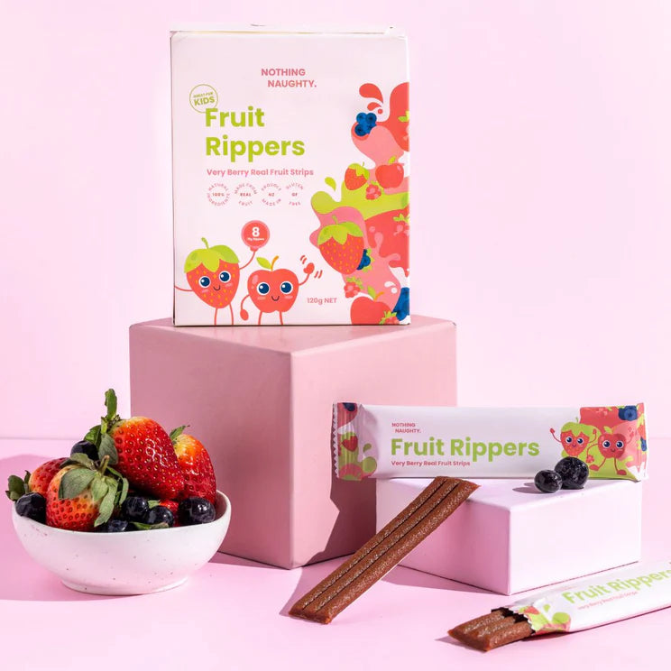 Fruit Rippers product packaging with a bowl of strawberries and blueberries on a pink background