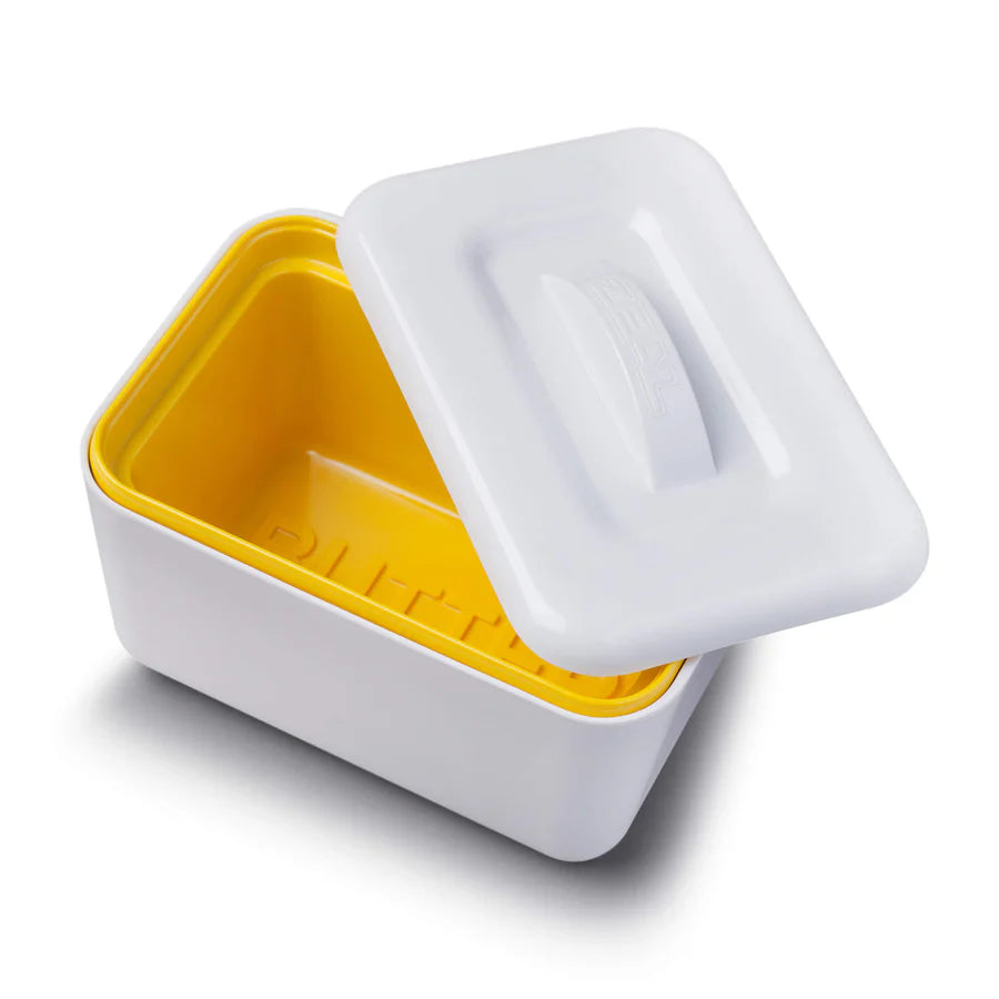 White and yellow container with a lid on a white background
