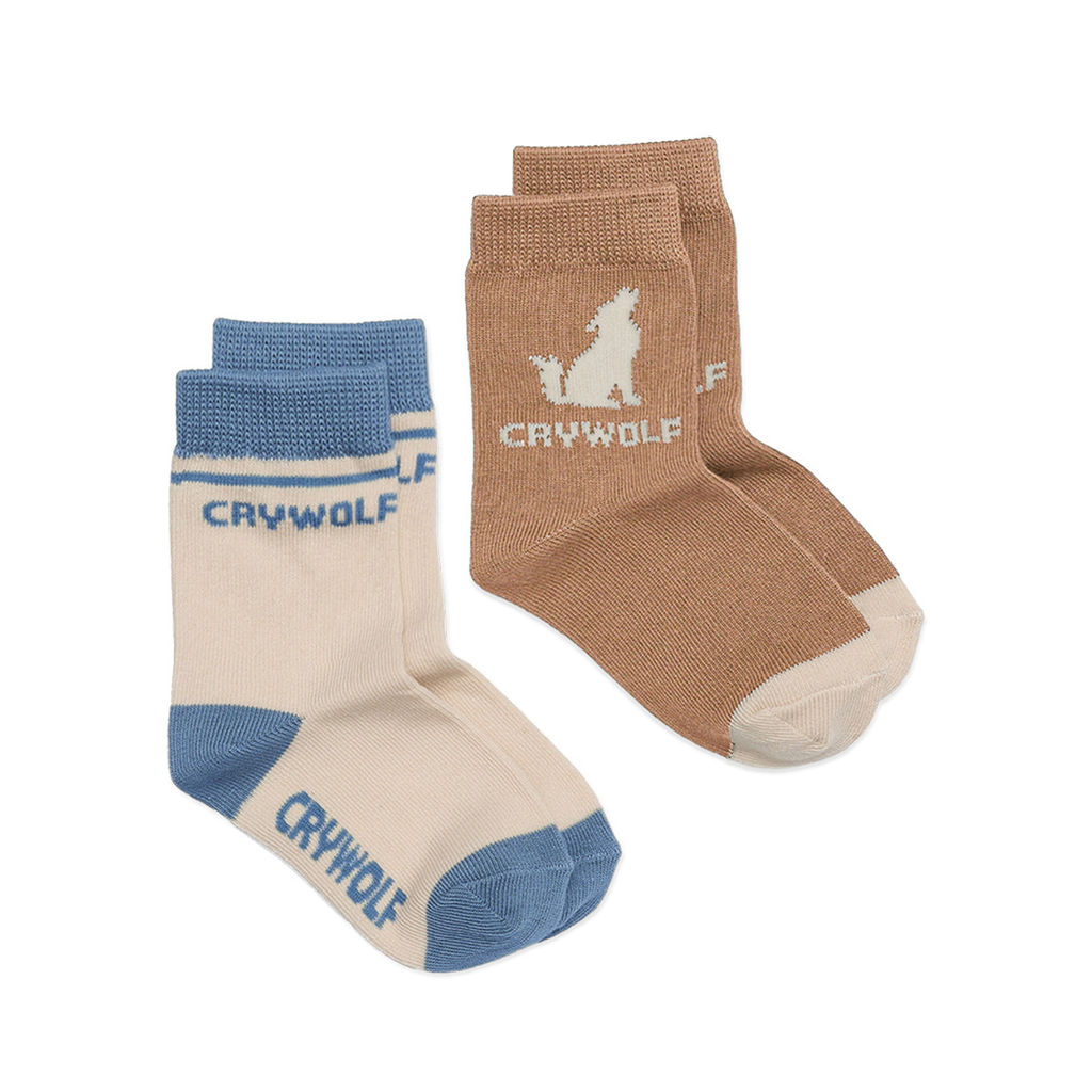 A pair of socks labeled "CRYWOLF" multiple times, one pair being white and blue, the other brown and beige