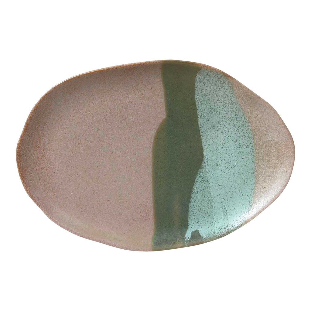 A grey natural shaped ceramic serving tray with green and blue paint stroke features 