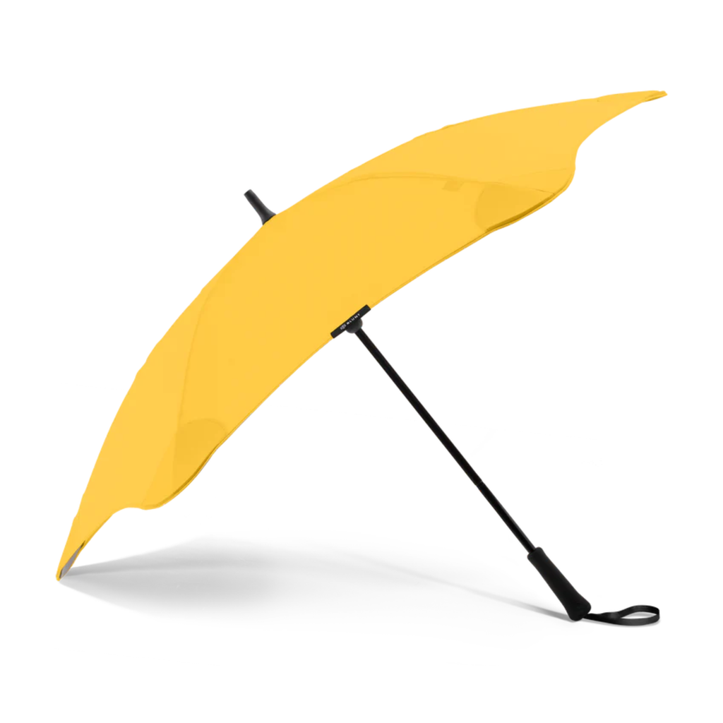 A yellow and black handle blunt brand umbrella
