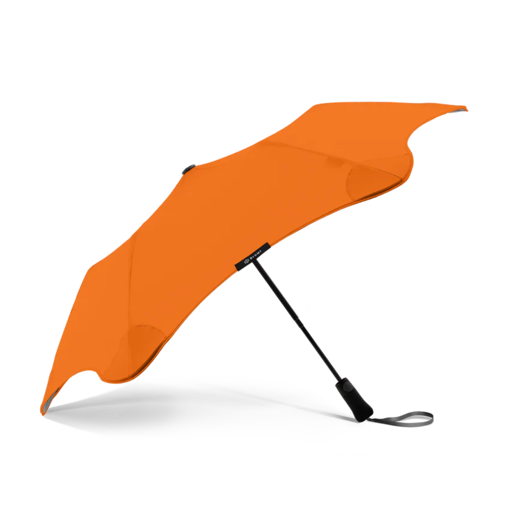 A orange and black handle blunt Metro brand umbrella