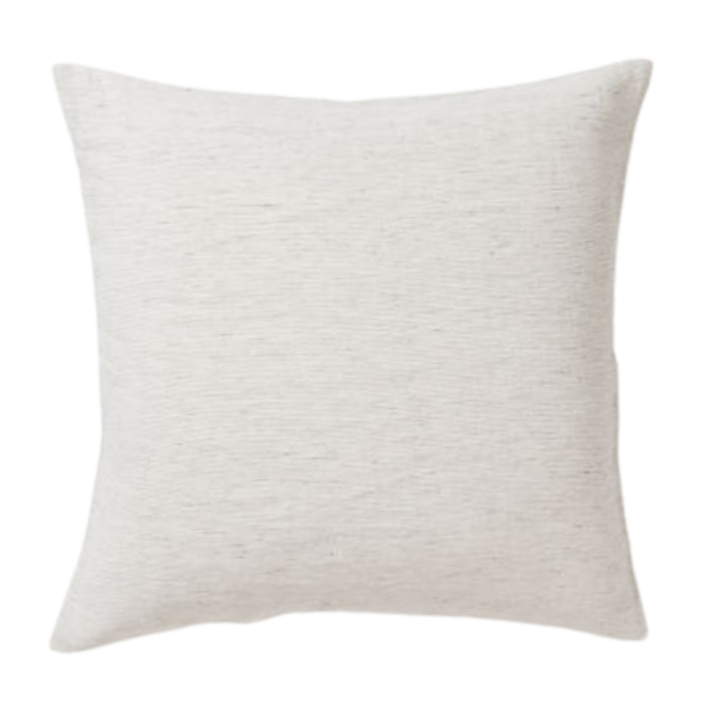 A white and grey textured patterned couch cushion