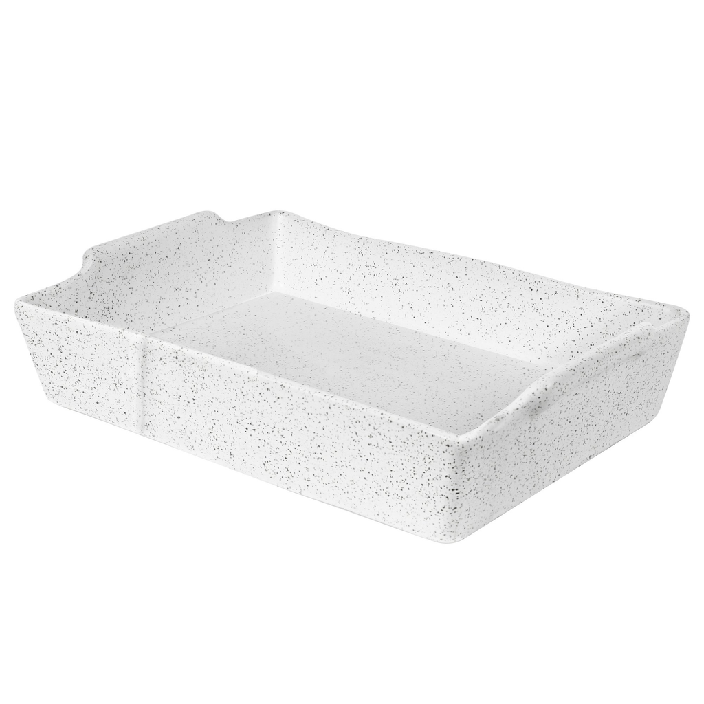 A  rectangle white and black speckled ceramic serving dish positioned against a white background.